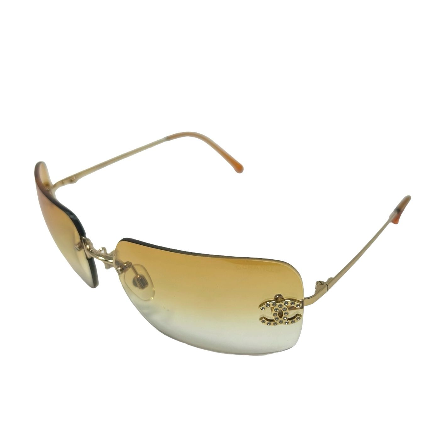 Chanel Light Orange Rhinestone Logo Rimless Sunglasses – Treasures 