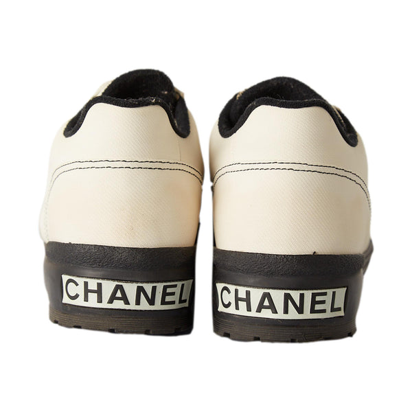 Chanel Ivory + Black Logo Sneakers