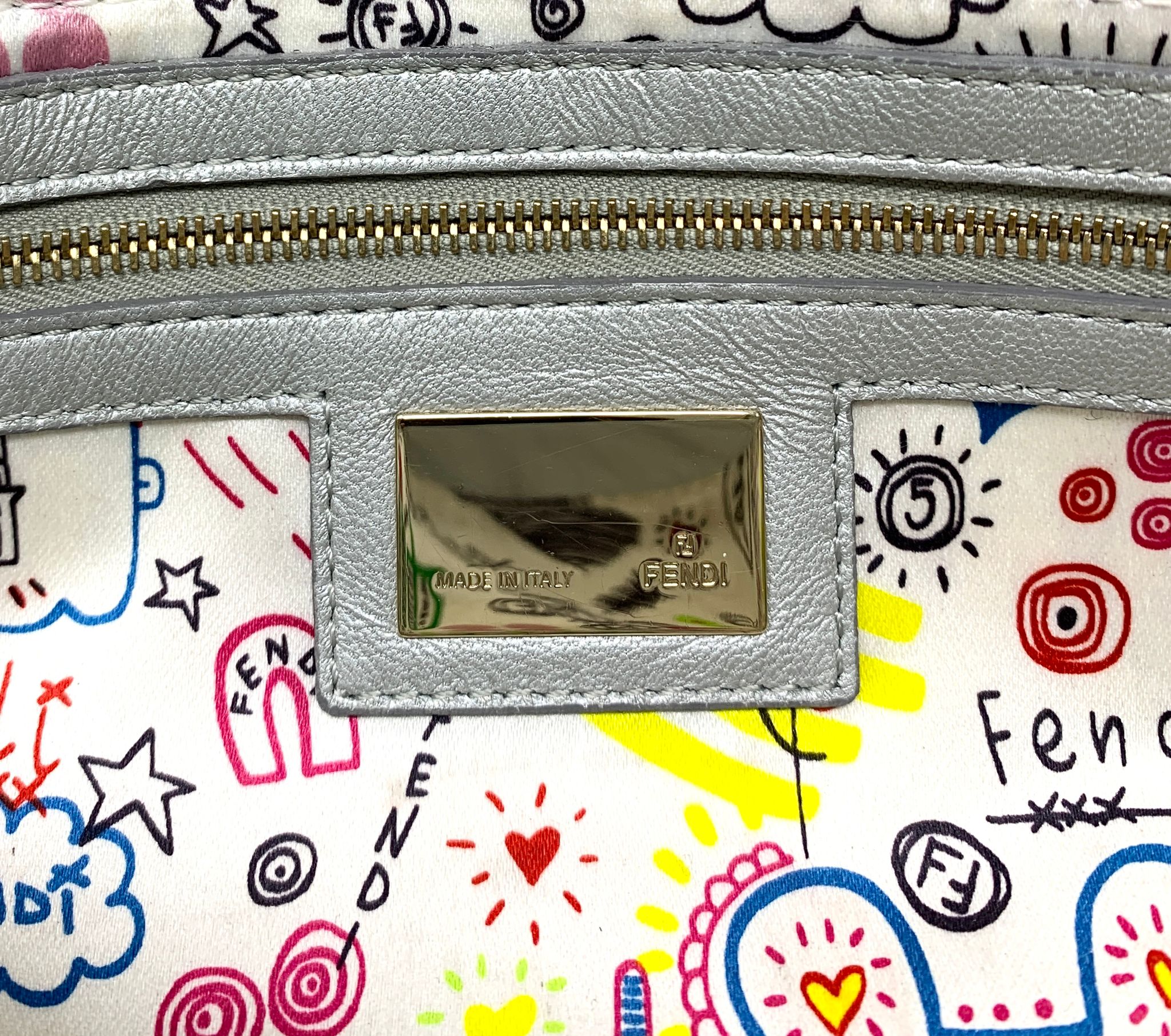 Fendi Silver Embossed Logo Baguette Bag - Handbags